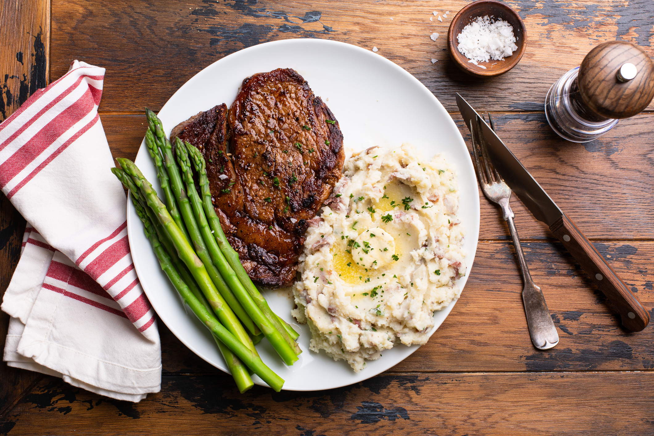 New York Strip with Maitre Butter, Horseradish Mashed Potatoes, and Asparagus Recipe