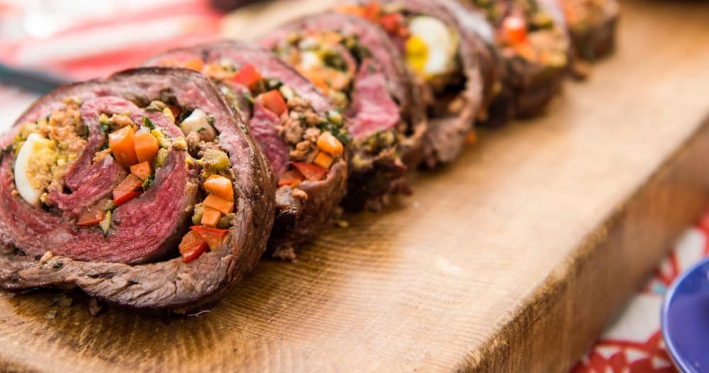 Rolled Stuffed Flank Steak with Garlicky Herb Sauce