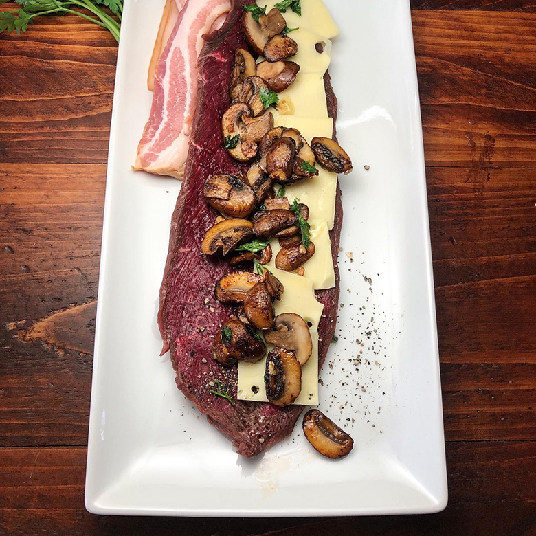Roasted Elk Tenderloin with Bacon Wrapped Salsify, Jerusalem Artichokes, and Creamy Wild Mushroom Sauce Recipe