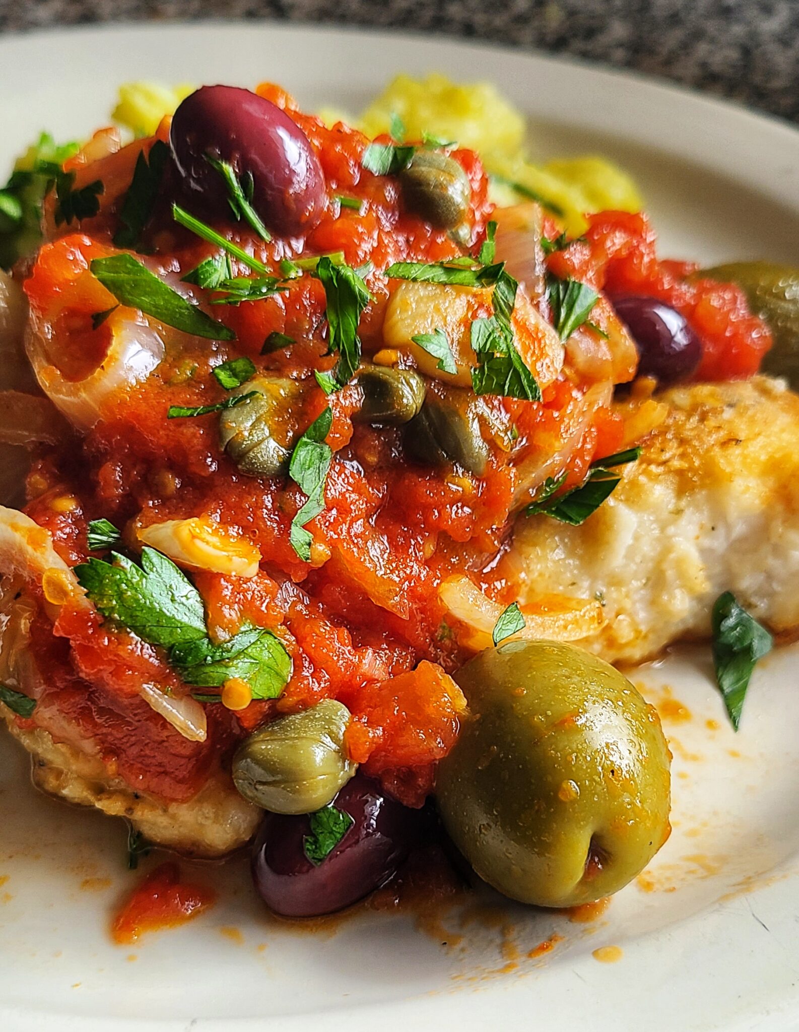 Sturgeon with Caper, Olive and Tomato Sauce Recipe