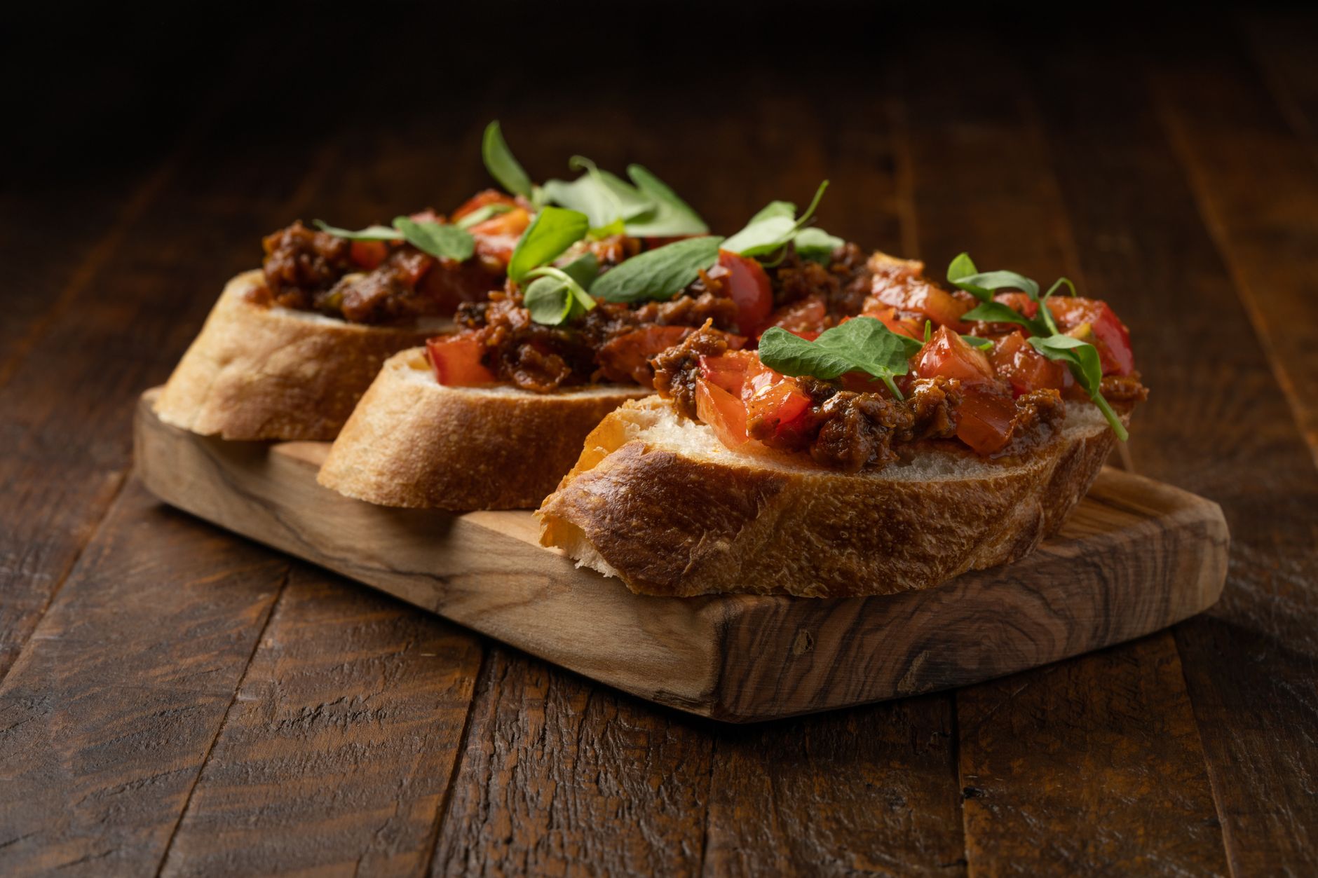 Fiery Summer Bruschetta with Zesty Olive Spread and Spicy Candied Bacon