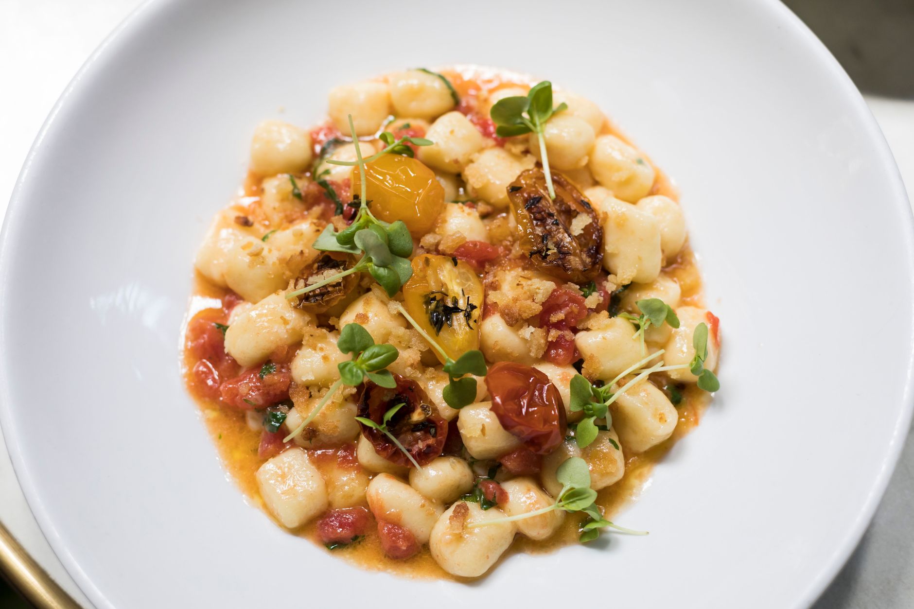 Goat Cheese Ricotta Gnocchi with Garden Zucchini Tomato Sauce and Crisp Prosciutto
