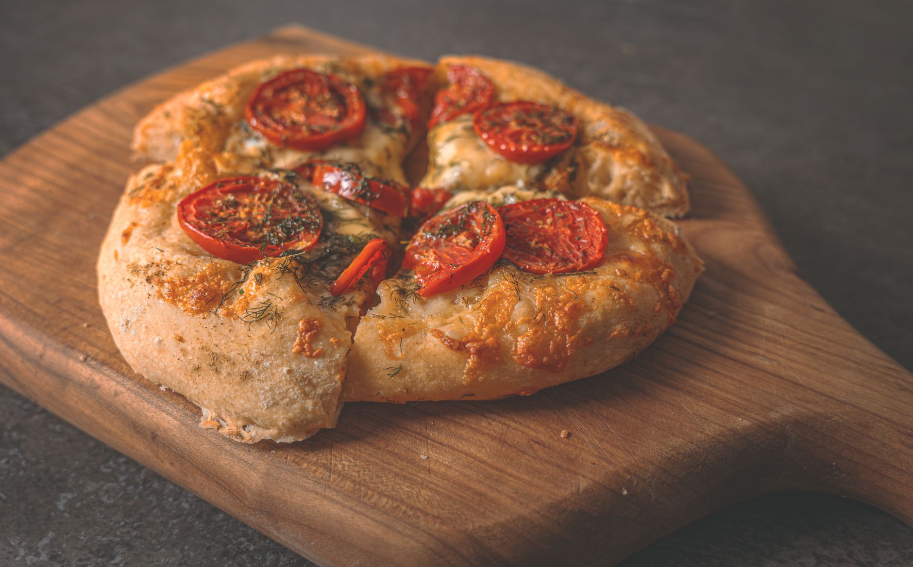 Grilled Flatbread with Ricotta Cheese, Fresh Tomatoes, Oregano and Roasted Garlic Oil