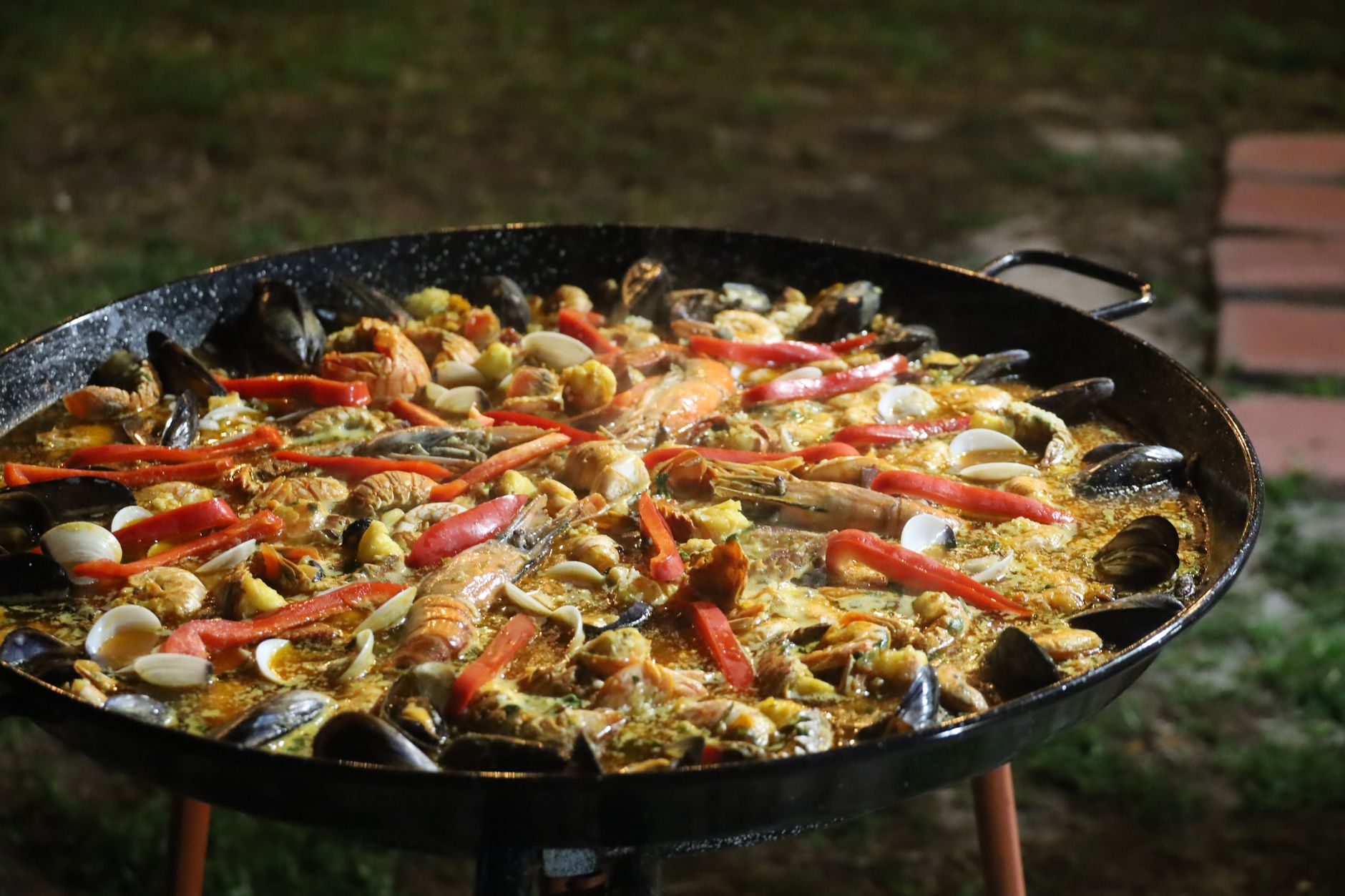 Paella with Chicken, Chorizo, Merguez Sausage and Clams with Roasted Garlic, Saffron and Lemon Aïoli